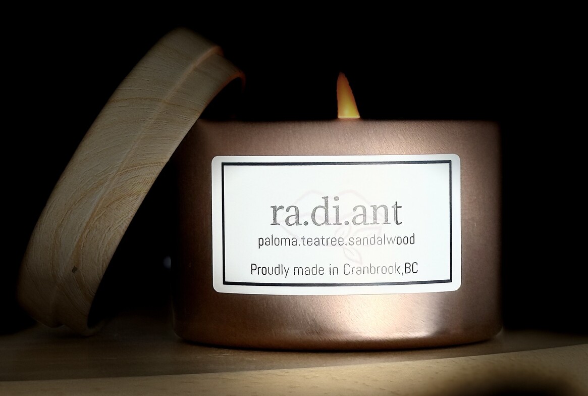 ra.di.ant candle buringing with vignette background